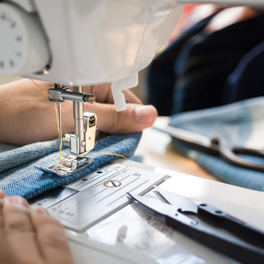 Skilled tailor stitching custom sportswear in Lenvy Sports production unit